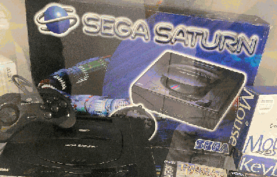 A picture of Sega Saturn with box